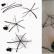 Telaraña de bricolaje con una araña castaña y una libélula hecha de materiales naturales